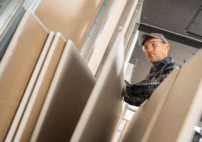 Low angle view of man standing in train