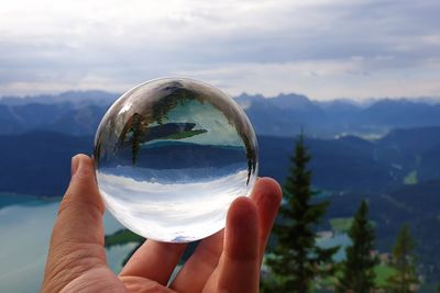 Lake walchensee reflecting in a crystal ball