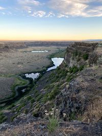 Scenic view of landscape against sky during sunset