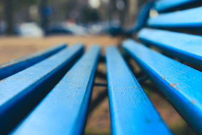 Close-up of bench in park