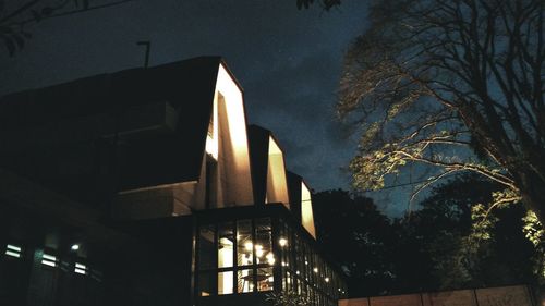 Low angle view of illuminated building against the sky