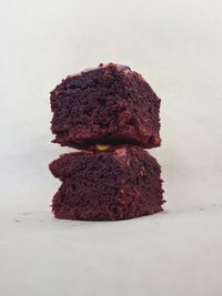 Close-up of cake on table against white background
