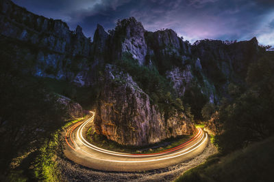 High angle view of road amidst trees against sky cheddar light trails 