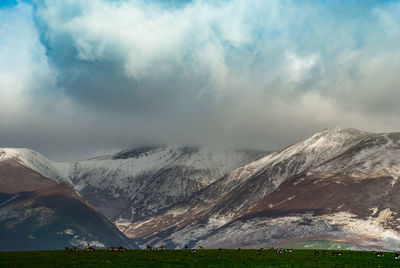 Scenic view of snowcapped mountains against sky