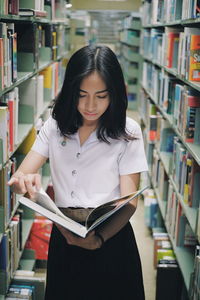 Young woman reading book