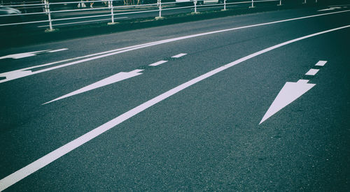 High angle view of arrow symbol on road