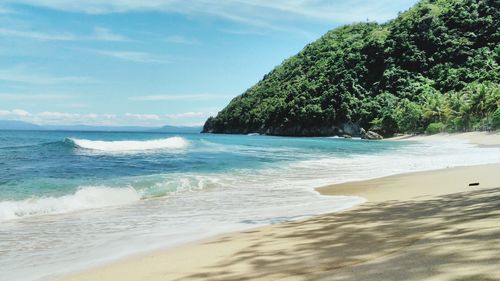 Scenic view of beach against sky