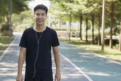 Portrait of young man standing outdoors