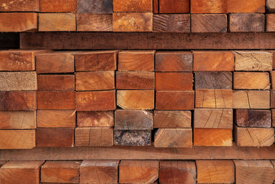 Stack of lumber in sawmill. wood materail for construction industry. pile of timber storage 