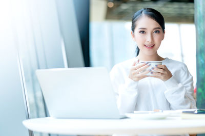 Young woman using mobile phone