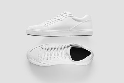 Close-up of shoes over white background