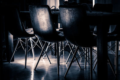 Empty chairs arranged on floor