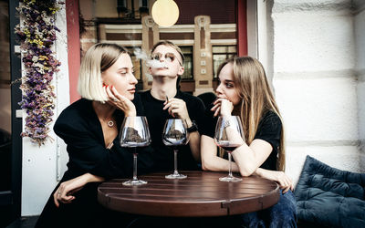 Young woman drinking glasses