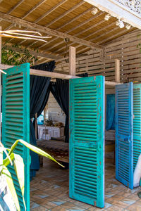 Blue metallic structure with bridge in background