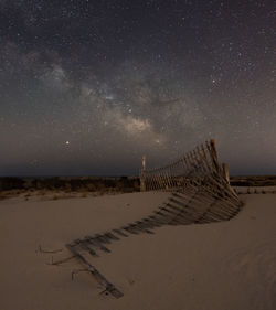 Broken wooden fence at beach 