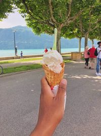 Cropped image of hand holding ice cream cone