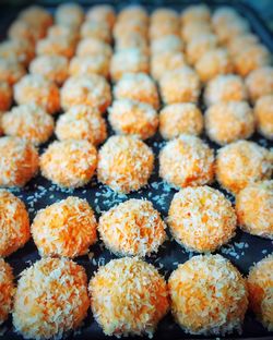 Close-up of orange snowball cookies at store