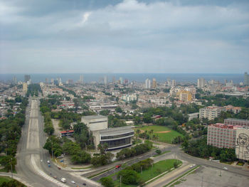 High angle view of street amidst buildings against sky