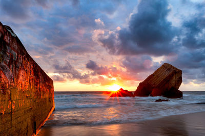 Scenic view of sea against sky during sunset