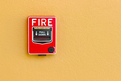 Close-up of fire alarm on wall