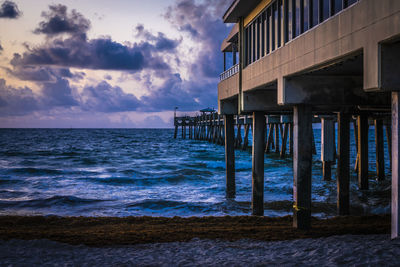 Pier over sea against sky