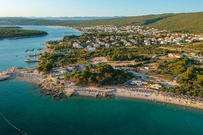 High angle view of townscape by sea