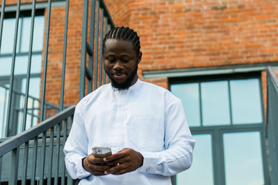 Young man using mobile phone