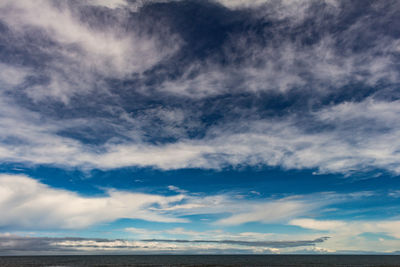 Low angle view of dramatic sky over sea