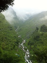 Scenic view of mountains in foggy weather