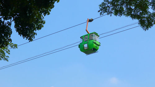 Low angle view of power lines against sky