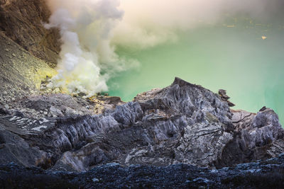 Smoke emitting from volcanic mountain