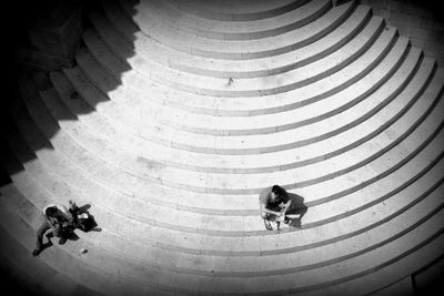 High angle view of men walking on steps