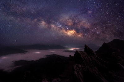 Scenic view of sea against sky at night