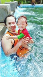 Portrait of a smiling girl in swimming pool