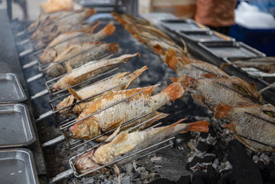 Close-up of fish on barbecue grill