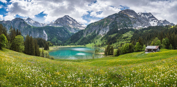 Scenic view of snowcapped mountains against sky