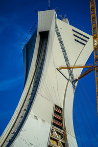 Low angle view of bridge against blue sky