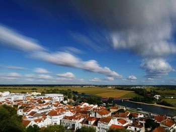 Houses in town against sky