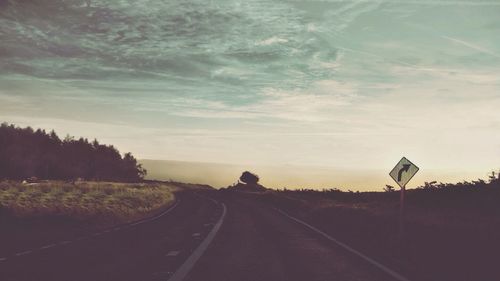 Road amidst landscape against sky