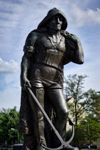 Low angle view of statue against sky