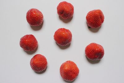 High angle view of strawberries against white background