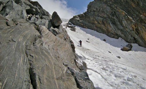 Panoramic view of people on mountain against sky