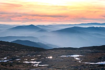 Scenic view of mountains against sky during sunset