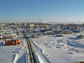 High angle view of buildings against clear sky during winter