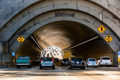 Cars under tunnel in city