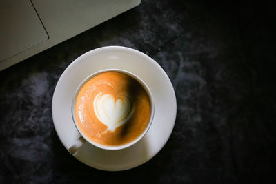 High angle view of coffee cup on table