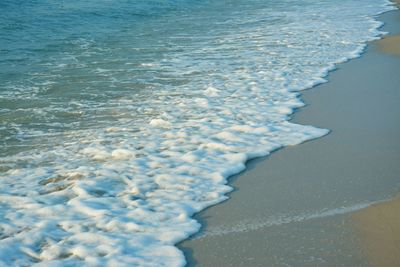 High angle view of surf on beach