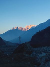 Scenic view of mountains against clear blue sky