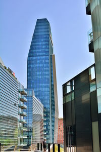 Low angle view of modern buildings against clear sky