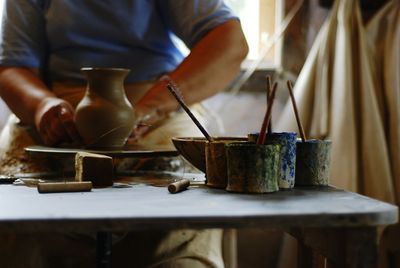 Artist making pottery